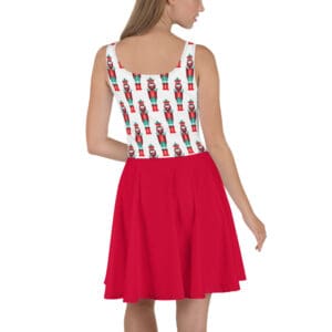 A woman wearing a red skirt and white top