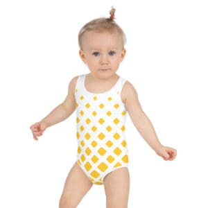 A baby wearing a yellow polka dot swimsuit.