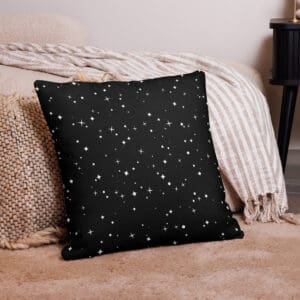 A black pillow with white stars on it