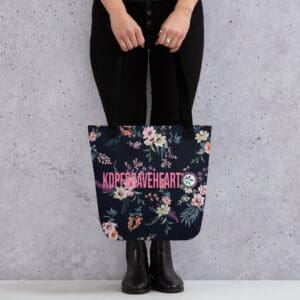 A person holding onto a bag with flowers