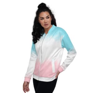 A woman wearing a white, pink and blue jacket.