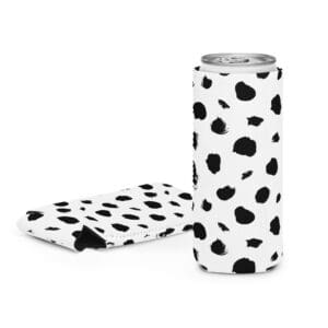 A can of soda and a sleeve with spots on it.