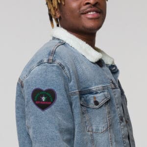 A man with dreads in a jean jacket.