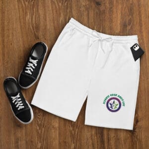 A pair of white shoes and shorts on the floor
