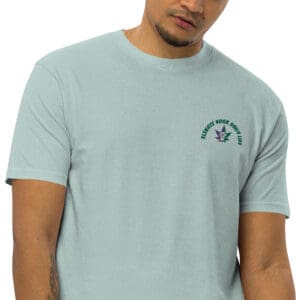 A man wearing a light blue t-shirt with the words " life is good."
