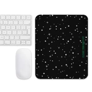 A mouse pad, keyboard and mousepad with stars on it.