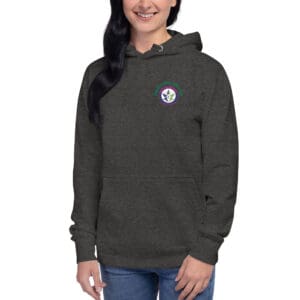 A woman wearing a hoodie with a patch on the chest.