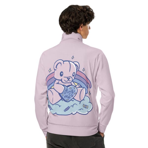 A person wearing a jacket with a teddy bear on it