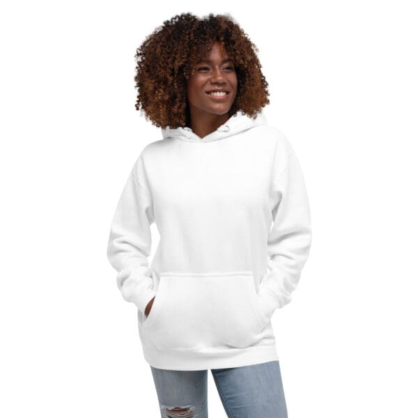 A woman wearing a white hoodie with her hands in pockets.