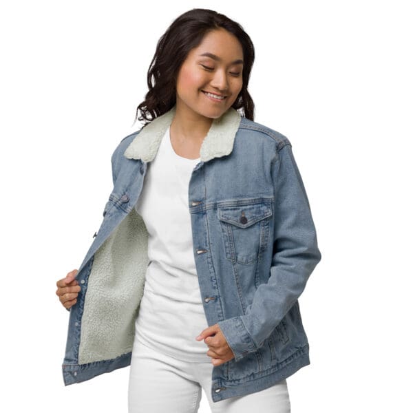 A woman in white shirt and jean jacket.