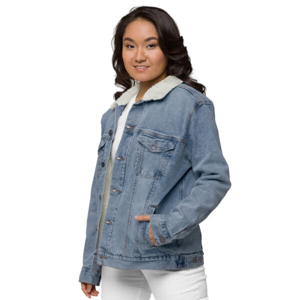 A woman wearing a jean jacket with fur lining.